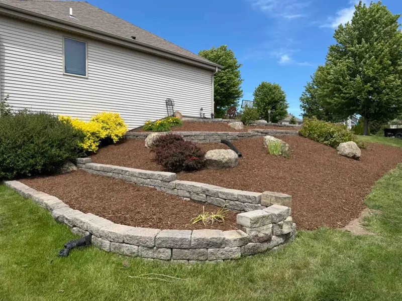 Stone-edged garden bed after